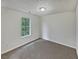 Simple bedroom with neutral walls and carpet flooring at 9105 Sterling Lakes Cir, Covington, GA 30014