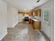 Kitchen with wood cabinets and door to outside at 9105 Sterling Lakes Cir, Covington, GA 30014