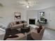 Virtually staged living room features neutral decor and a fireplace at 9105 Sterling Lakes Cir, Covington, GA 30014
