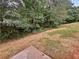 Large backyard with mature trees and grassy area at 9105 Sterling Lakes Cir, Covington, GA 30014