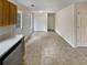 Bright kitchen with tile flooring and stainless steel dishwasher at 9105 Sterling Lakes Cir, Covington, GA 30014