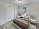 Virtually staged bedroom with double doors and a window at 9105 Sterling Lakes Cir, Covington, GA 30014