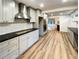 Updated kitchen boasts stainless steel appliances and gray cabinets at 3624 Nessa Se Ct, Smyrna, GA 30082