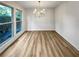 Bright dining room with hardwood floors and chandelier at 3624 Nessa Se Ct, Smyrna, GA 30082