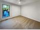 Bright bedroom with neutral walls, plush carpeting, and a double-door closet at 3624 Nessa Se Ct, Smyrna, GA 30082