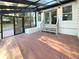 Sunroom with tile flooring, glass ceiling, and access to backyard at 3624 Nessa Se Ct, Smyrna, GA 30082