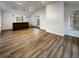 Bright game room features an open floor plan, modern bar, and luxury vinyl plank flooring at 3624 Nessa Se Ct, Smyrna, GA 30082