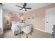 Bedroom with a pink bed, desk, and floral wall decor at 404 Beacon Way, Villa Rica, GA 30180