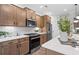 Kitchen boasts stainless steel appliances and light wood cabinets at 404 Beacon Way, Villa Rica, GA 30180