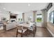 Casual dining area with wood table and chairs, adjacent to living room at 404 Beacon Way, Villa Rica, GA 30180