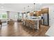 Modern kitchen with an island, stainless steel appliances, and light wood cabinets at 404 Beacon Way, Villa Rica, GA 30180