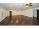 Finished basement with wood-look floors and multiple ceiling fans at 110 Mountain Laurel Ct, Canton, GA 30114