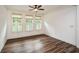 Spacious bedroom with wood flooring and plantation shutters at 110 Mountain Laurel Ct, Canton, GA 30114