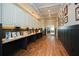 Bright hallway with granite countertops, cabinets, and hardwood floors at 110 Mountain Laurel Ct, Canton, GA 30114