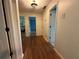 Bright hallway with hardwood floors and access to bedrooms and bathrooms at 5220 Forest Brook Pkwy, Marietta, GA 30068