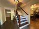 Entryway with staircase and views into adjacent rooms at 5220 Forest Brook Pkwy, Marietta, GA 30068