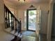 Bright entryway with staircase and view to backyard at 5220 Forest Brook Pkwy, Marietta, GA 30068