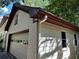 Side view of house showcasing white brick and siding with maroon trim at 5220 Forest Brook Pkwy, Marietta, GA 30068