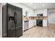 Kitchen with stainless steel appliances and white cabinets at 1486 Willow Bnd, Woodstock, GA 30188