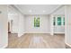 Bright dining room with hardwood floors and large window at 1486 Willow Bnd, Woodstock, GA 30188