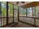 Relaxing screened porch with wooden deck at 1486 Willow Bnd, Woodstock, GA 30188