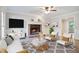 Living room with fireplace, stylish furnishings, and hardwood floors at 1486 Willow Bnd, Woodstock, GA 30188