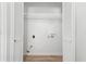 Laundry room with built-in shelving and white doors at 1486 Willow Bnd, Woodstock, GA 30188