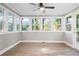 Sunroom with wall-to-wall windows and hardwood floors at 1486 Willow Bnd, Woodstock, GA 30188