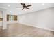 Bright living room featuring hardwood floors and a ceiling fan at 1486 Willow Bnd, Woodstock, GA 30188