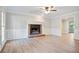 Living room with brick fireplace and hardwood floors at 1486 Willow Bnd, Woodstock, GA 30188