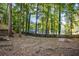 Wooded backyard with partial fence at 1486 Willow Bnd, Woodstock, GA 30188