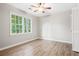 Spacious bedroom with neutral walls and wood flooring at 1486 Willow Bnd, Woodstock, GA 30188