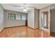 Bedroom with wood floors, ceiling fan and window at 5005 Jones Rd, Fairburn, GA 30213