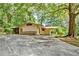 Mid-century ranch home with a large yard and mature trees at 5005 Jones Rd, Fairburn, GA 30213