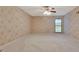 Bedroom with floral wallpaper and wall-to-wall carpeting at 5005 Jones Rd, Fairburn, GA 30213