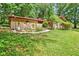 Brick ranch home with a landscaped yard and walkway at 5005 Jones Rd, Fairburn, GA 30213