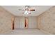 Spacious bedroom with ample closet space and neutral carpeting at 5005 Jones Rd, Fairburn, GA 30213