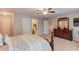 Main bedroom with ensuite bathroom and dresser at 2677 Gold Rust Dr, Buford, GA 30519