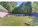 Relaxing backyard with a fenced-in pool and grassy area at 2677 Gold Rust Dr, Buford, GA 30519