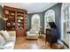 Charming library with built-in shelving, hardwood floors, and arched windows at 2262 Meadowvale Ne Dr, Atlanta, GA 30345