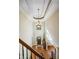 Two-story entryway with chandelier and hardwood floors at 2262 Meadowvale Ne Dr, Atlanta, GA 30345