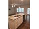 Modern kitchen island with granite countertops and stainless steel sink at 7298 Rockhouse Rd # 5, Austell, GA 30168