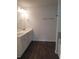 Bathroom with double vanity, dark floors, and shower/tub combo at 7298 Rockhouse Rd # 5, Austell, GA 30168