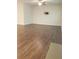 Living room with hardwood floors and ceiling fan at 7298 Rockhouse Rd # 5, Austell, GA 30168