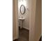 Elegant powder room with pedestal sink and dark vanity mirror at 7298 Rockhouse Rd # 5, Austell, GA 30168