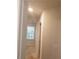 Bright hallway with neutral walls and carpet at 7298 Rockhouse Rd # 5, Austell, GA 30168