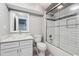 Basement bathroom with white vanity, subway tile shower, and glass enclosure at 4842 Coach Ln, Dunwoody, GA 30338