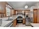 Kitchen with stainless steel appliances and wood cabinets at 1922 Marshes Glenn Dr, Norcross, GA 30071