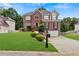 Two-story brick house with a large front yard at 1039 Ashfern Walk, Woodstock, GA 30189