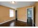 Spacious bedroom with hardwood floors and access to another room at 690 Green Acres Se Rd, Smyrna, GA 30080